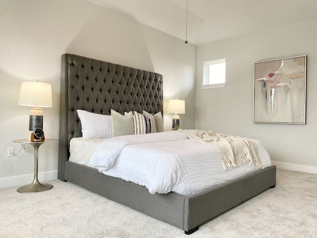 carpeted bedroom featuring lofted ceiling