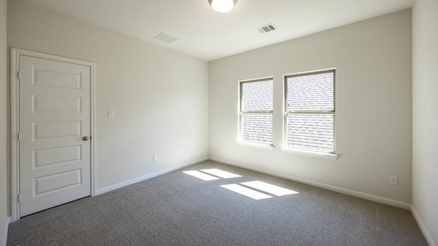 unfurnished room featuring carpet flooring