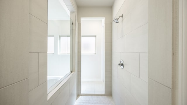 bathroom featuring tile patterned floors and shower with separate bathtub