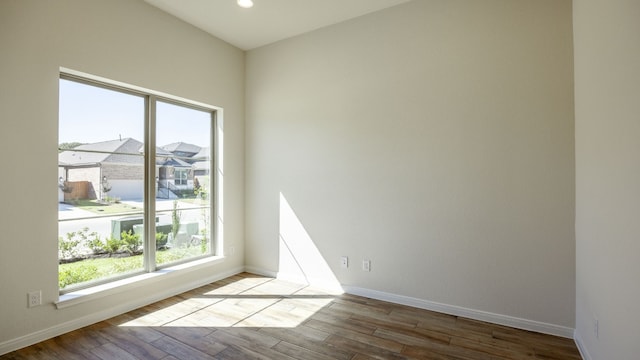 spare room with light wood-type flooring