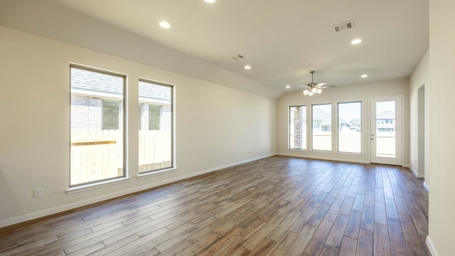 unfurnished room featuring lofted ceiling, hardwood / wood-style flooring, and ceiling fan