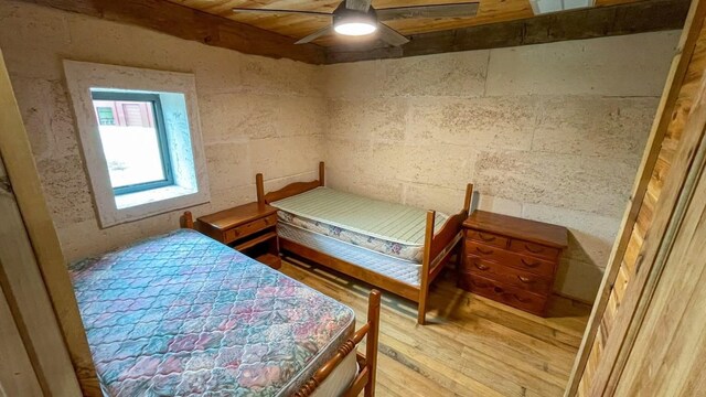 bedroom with hardwood / wood-style flooring and ceiling fan