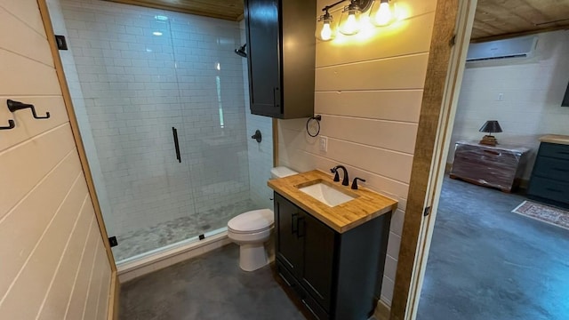 bathroom with vanity, a wall mounted AC, toilet, concrete flooring, and a shower with shower door