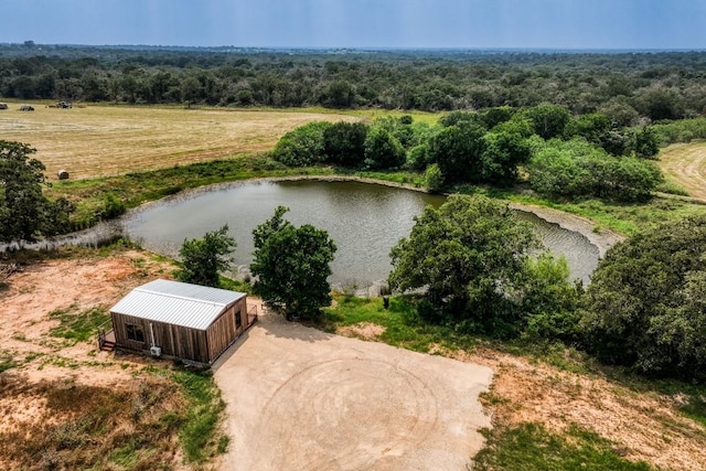 drone / aerial view featuring a water view and a rural view