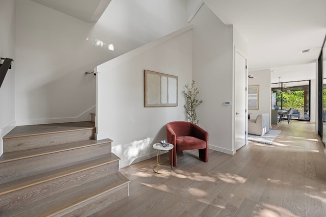 staircase featuring hardwood / wood-style flooring