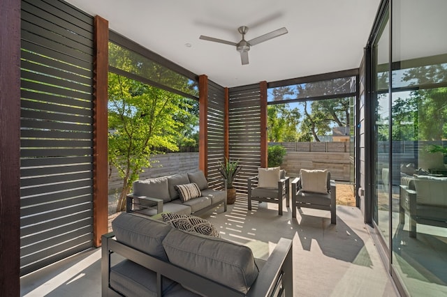 sunroom / solarium with plenty of natural light and ceiling fan