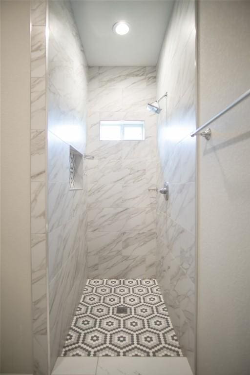 bathroom with tiled shower