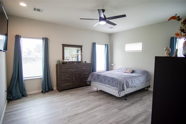 bedroom featuring light hardwood / wood-style floors and ceiling fan