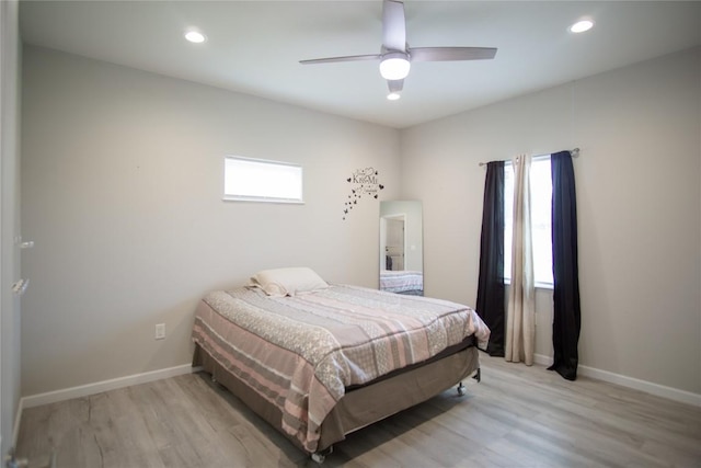 bedroom featuring ceiling fan and light hardwood / wood-style flooring