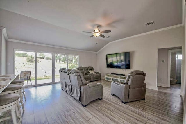 living room with ceiling fan, light hardwood / wood-style flooring, lofted ceiling, and ornamental molding