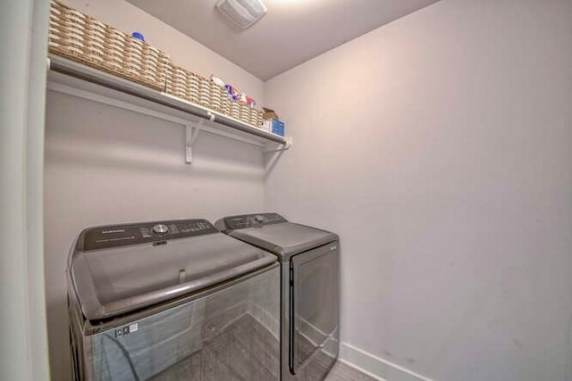 clothes washing area featuring washing machine and dryer