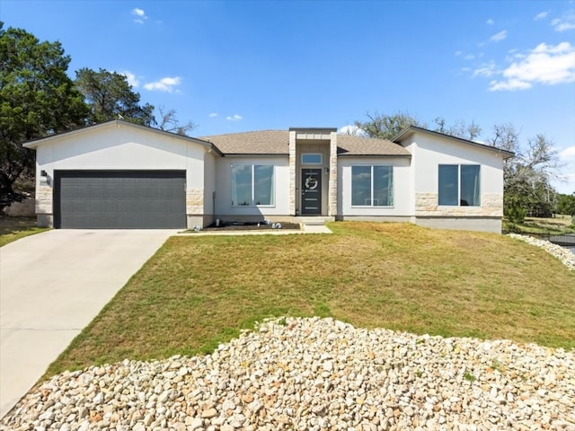 view of front facade featuring a garage and a front lawn