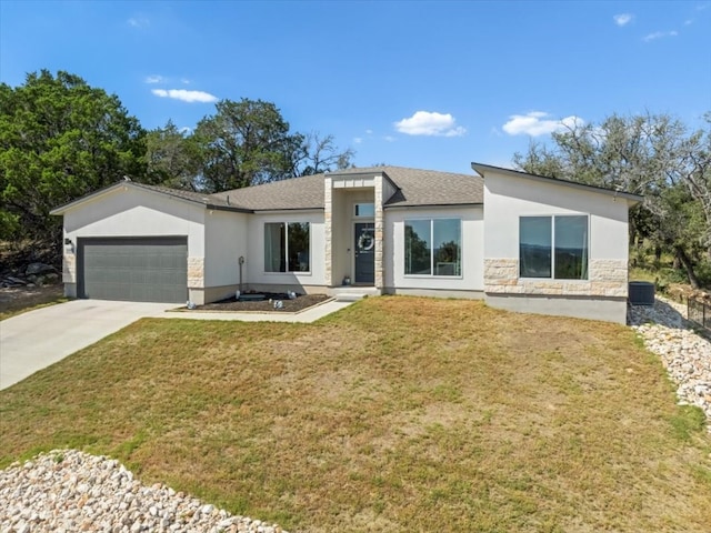 view of front facade with a front lawn and a garage