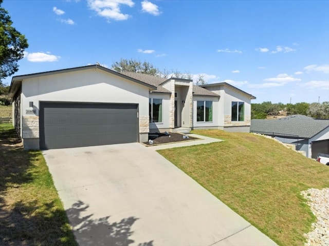 view of front facade with a garage and a front yard