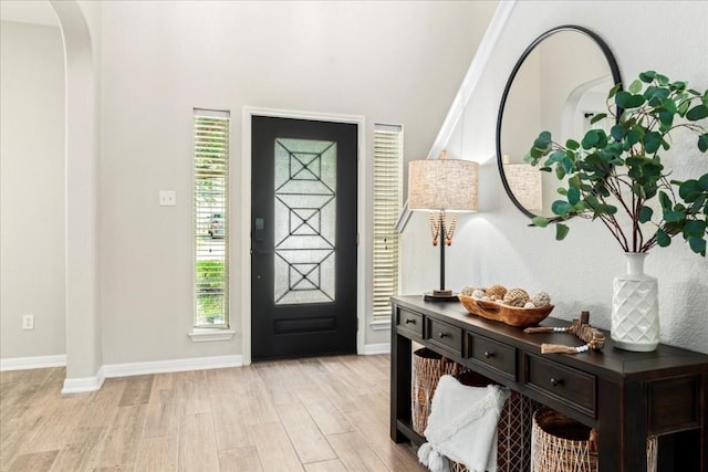 entryway with plenty of natural light and light hardwood / wood-style floors