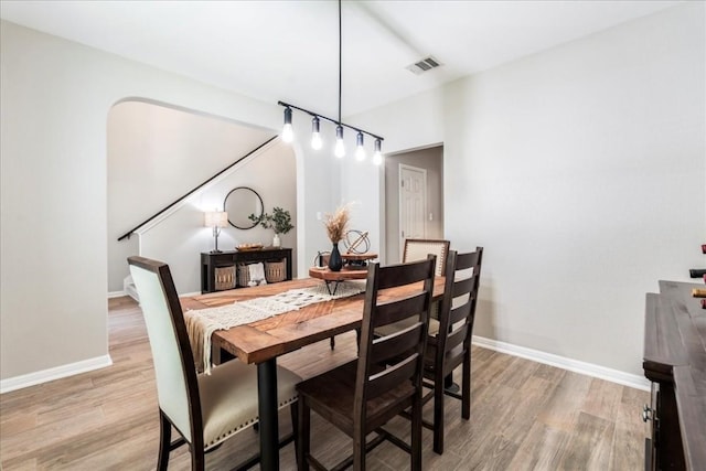 dining space featuring hardwood / wood-style flooring