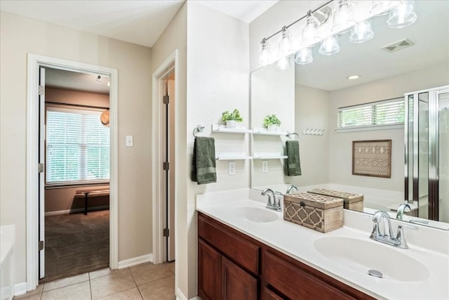 bathroom featuring tile patterned flooring, vanity, and independent shower and bath