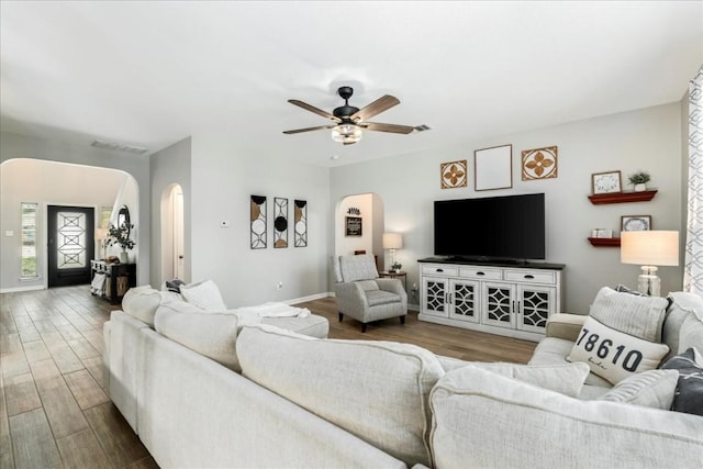 living room with hardwood / wood-style flooring and ceiling fan