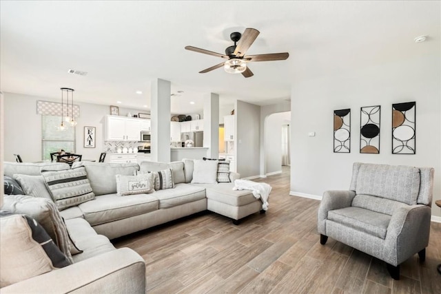 living room featuring ceiling fan