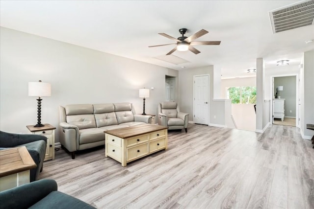 living room featuring ceiling fan and light hardwood / wood-style floors