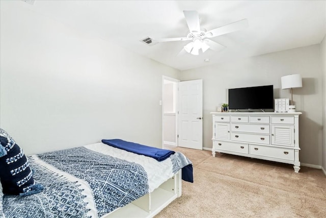 bedroom with light carpet and ceiling fan