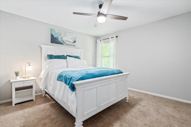 bedroom featuring ceiling fan and light carpet