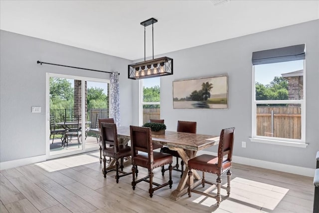 dining area with light hardwood / wood-style floors