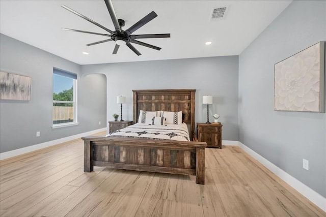 bedroom with light wood-type flooring and ceiling fan