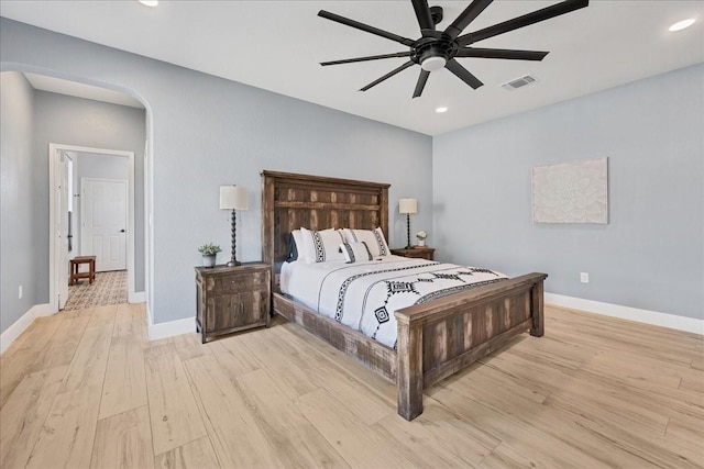 bedroom with ceiling fan and light hardwood / wood-style floors