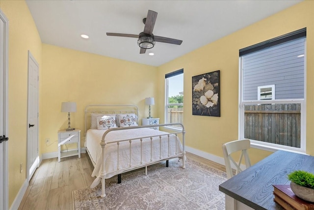 bedroom with ceiling fan and hardwood / wood-style floors