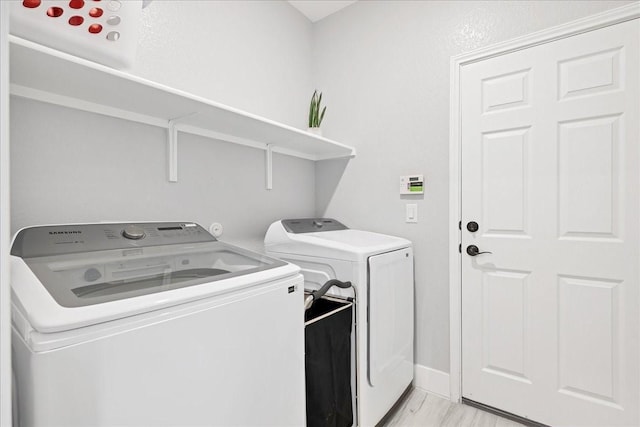 laundry area featuring washing machine and clothes dryer