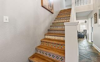 stairs with tile flooring