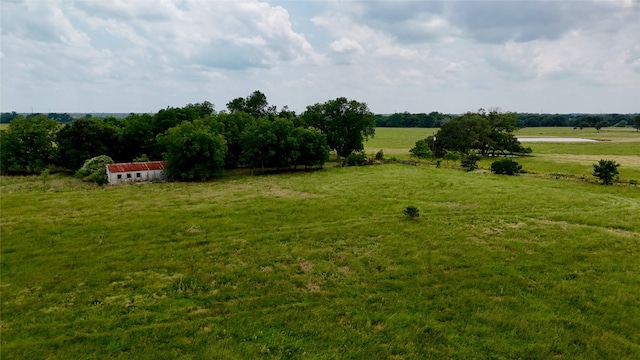 view of yard with a rural view