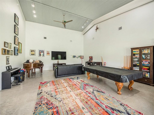 recreation room featuring ceiling fan, a towering ceiling, and pool table