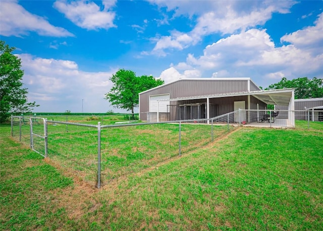 view of yard with an outbuilding and a rural view