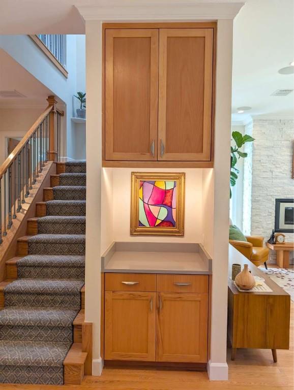 staircase with wood-type flooring