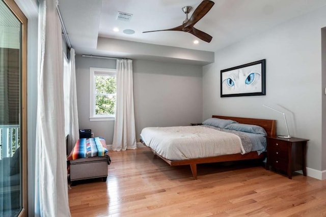 bedroom with ceiling fan and light hardwood / wood-style flooring