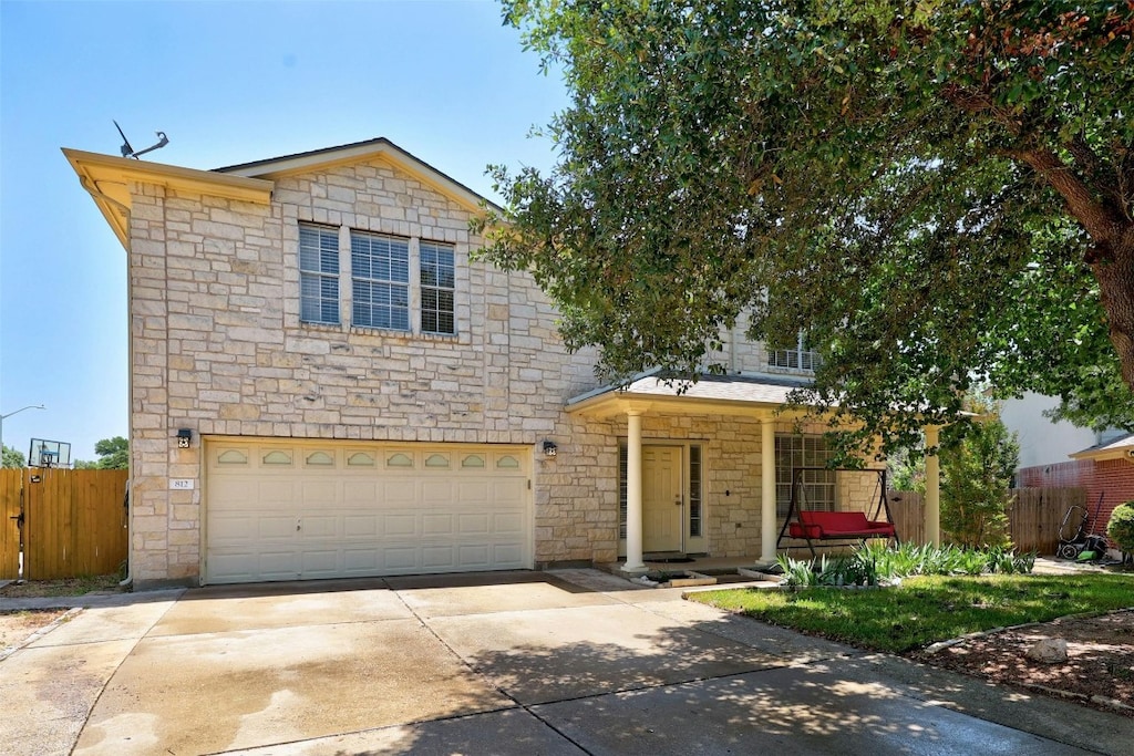 812 La Crema Ct, Leander, TX 78641 - view of front of house with stone siding, a garage, and concrete driveway