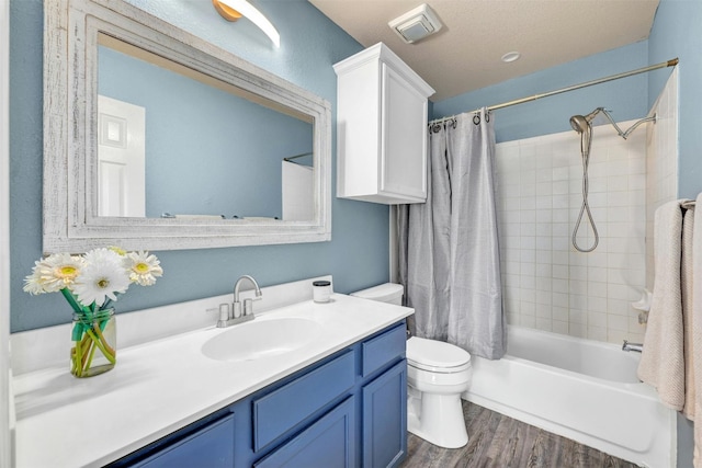 full bathroom with toilet, vanity, shower / bath combination with curtain, and wood-type flooring