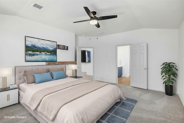 bedroom with light colored carpet, lofted ceiling, and ceiling fan