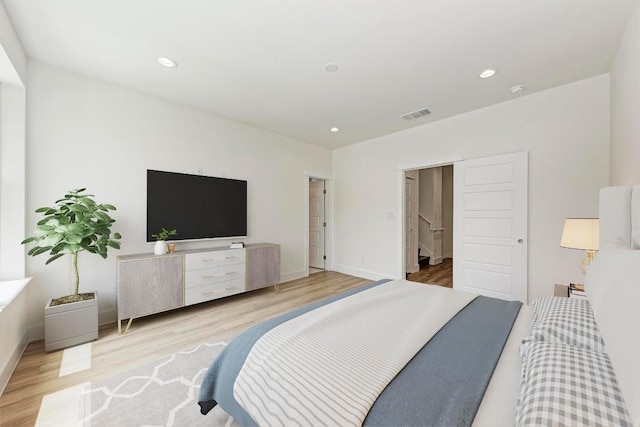 bedroom with light hardwood / wood-style floors