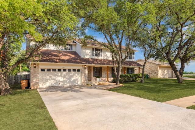 view of front of property featuring a front yard and a garage