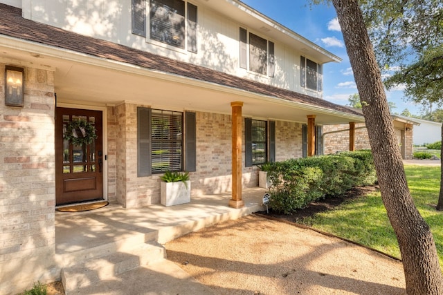 doorway to property featuring covered porch