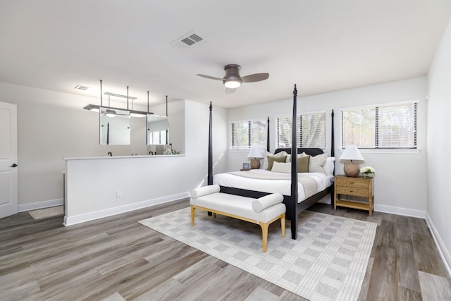 bedroom featuring hardwood / wood-style flooring and ceiling fan