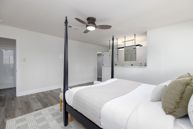 bedroom with wood-type flooring and ceiling fan