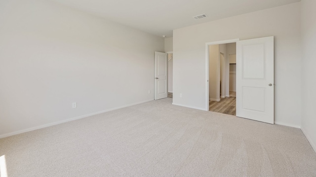 unfurnished bedroom with light carpet