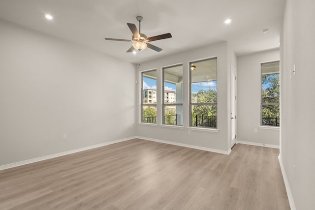 empty room featuring light hardwood / wood-style floors and ceiling fan