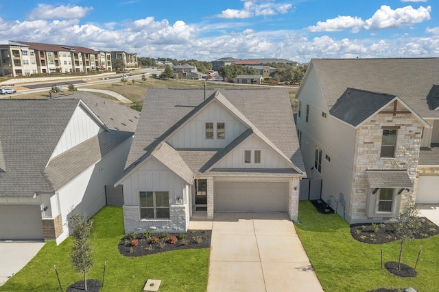 view of front of home featuring a front yard and a garage