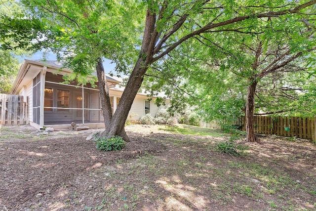 view of yard with a sunroom