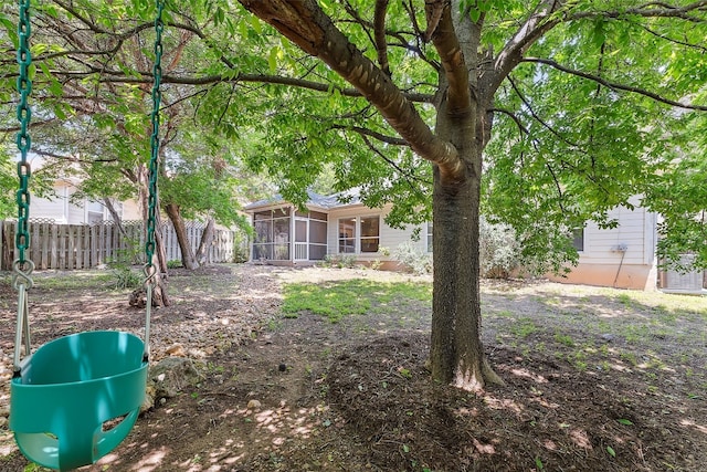 view of yard with a sunroom